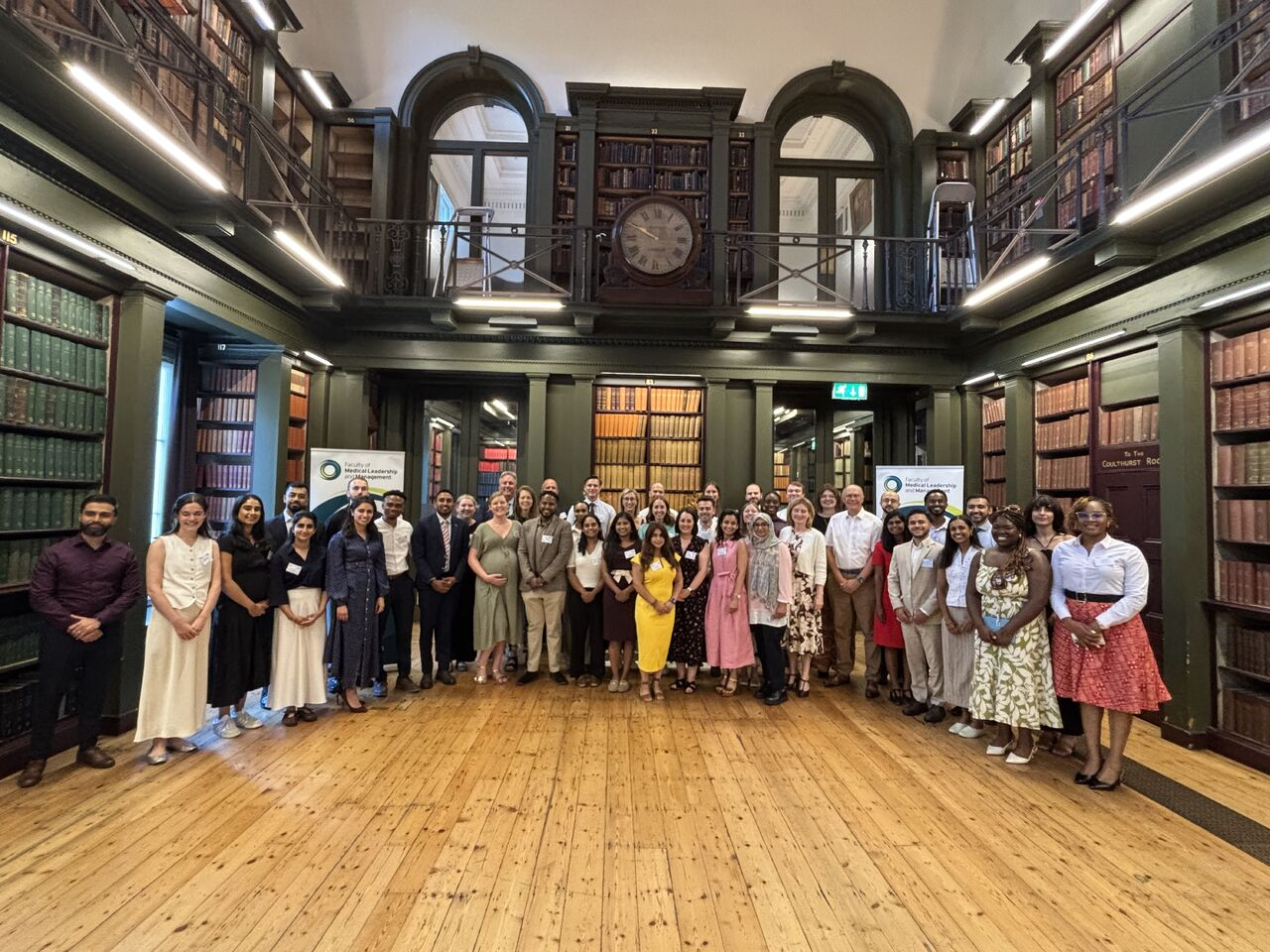 Groups of graduates in a library