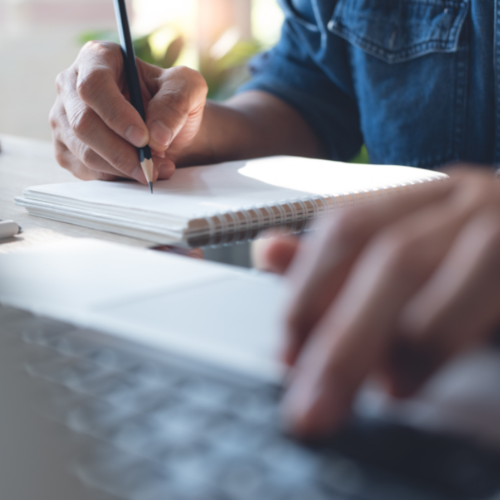 Doctor studying for CPD points at laptop